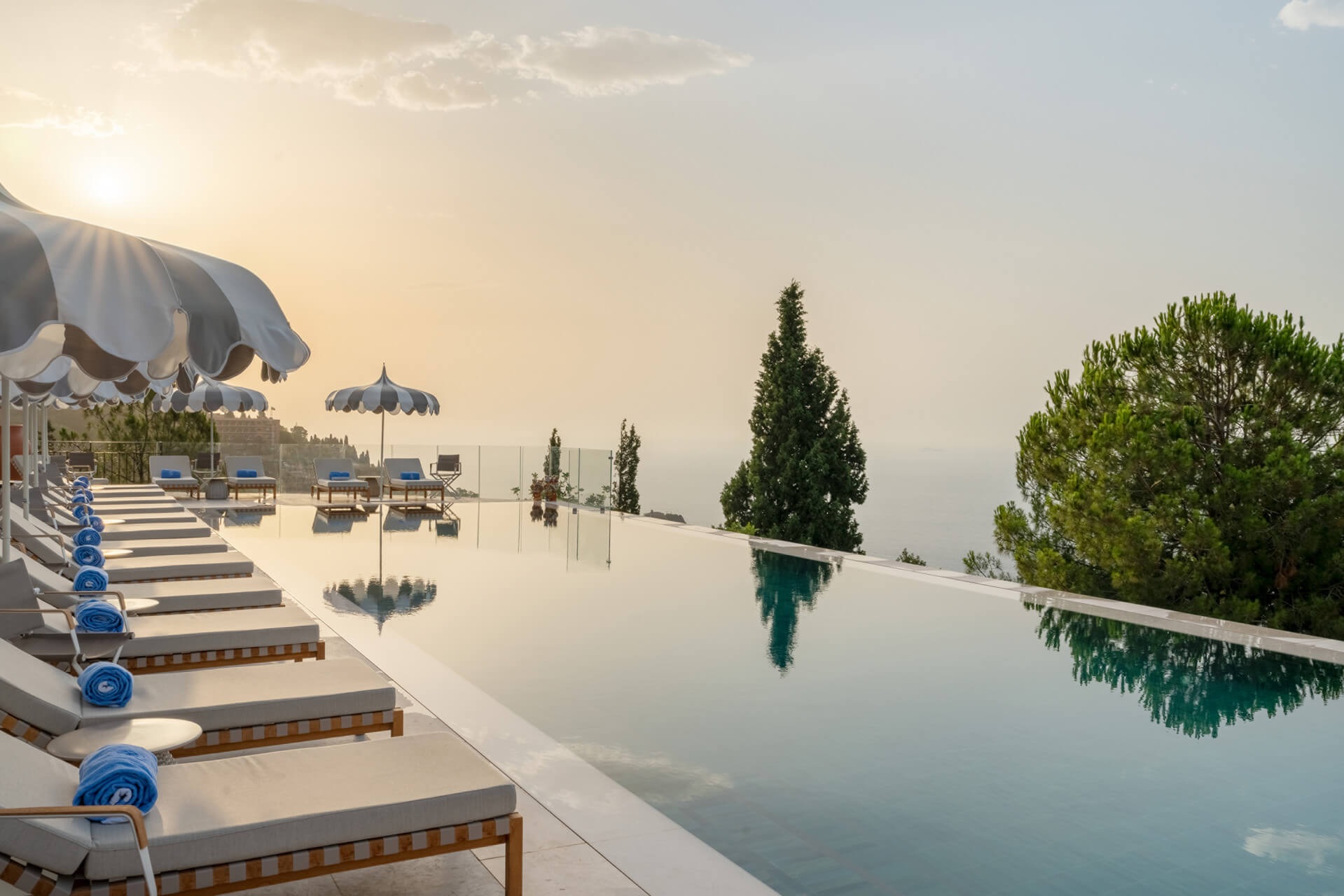 Infinity Pool & Gardens – San Domenico Palace, Taormina Infinity pool at San Domenico Palace Taormina during sunset with panoramic sea views